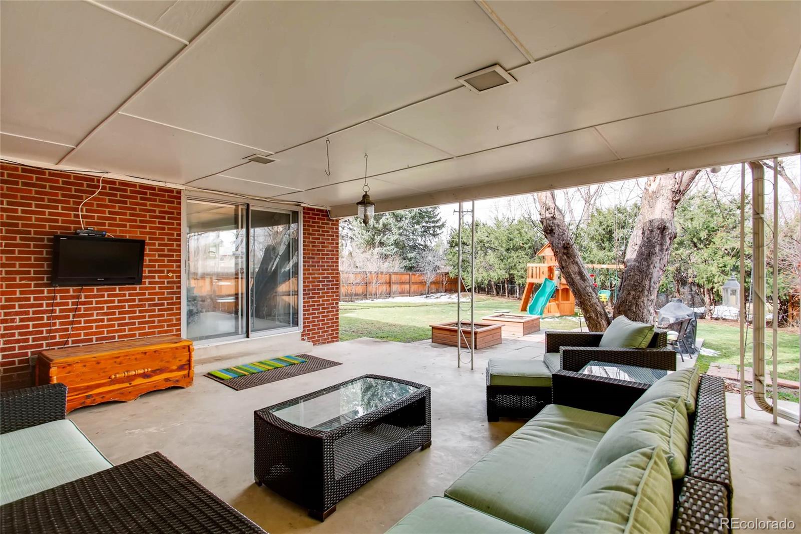 859 South Hudson Street Denver, CO 80246 - Photo 29 of 34 a living room with furniture and a flat screen tv