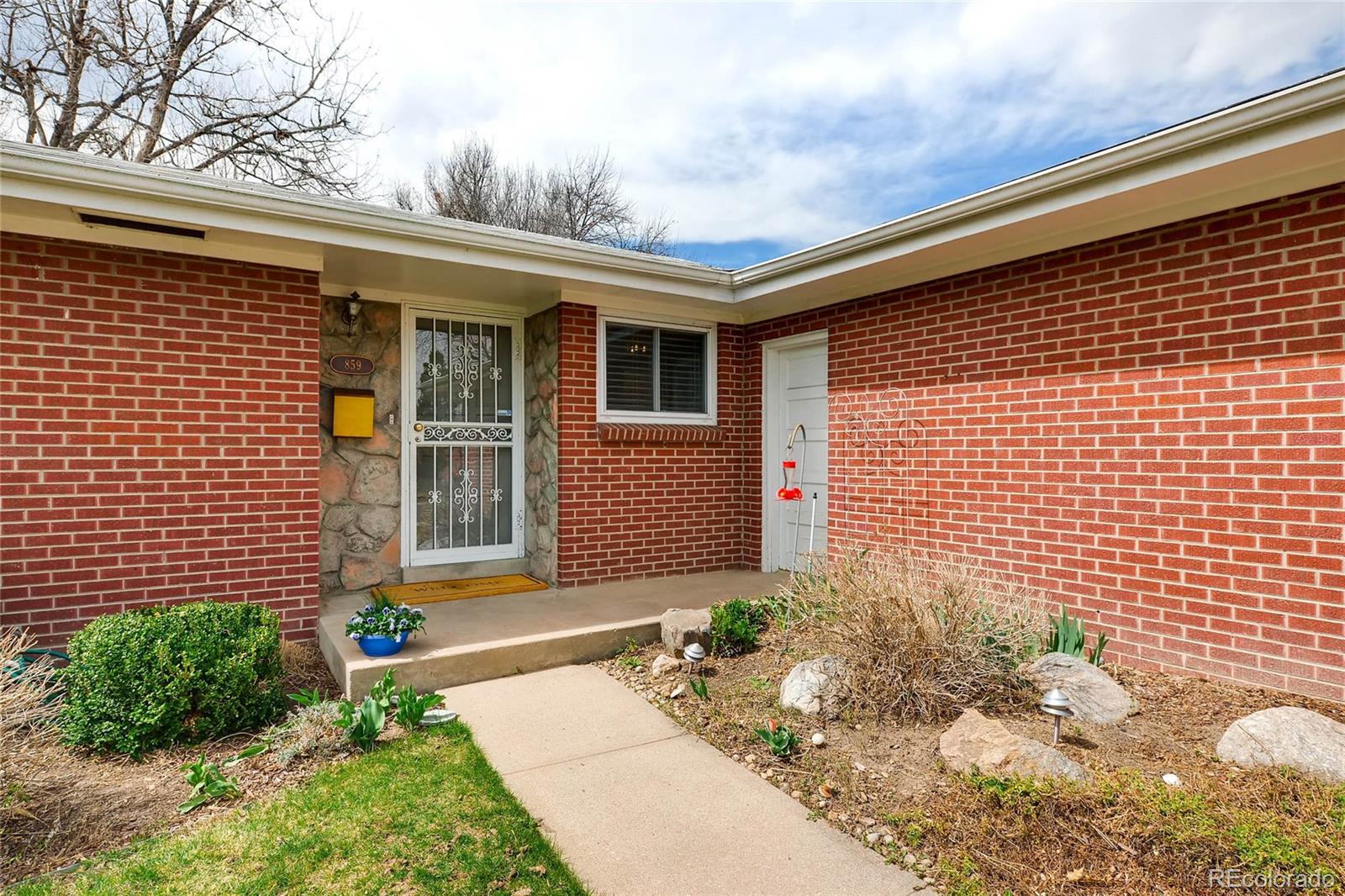 859 South Hudson Street Denver, CO 80246 - Photo 4 of 34 a front view of a house