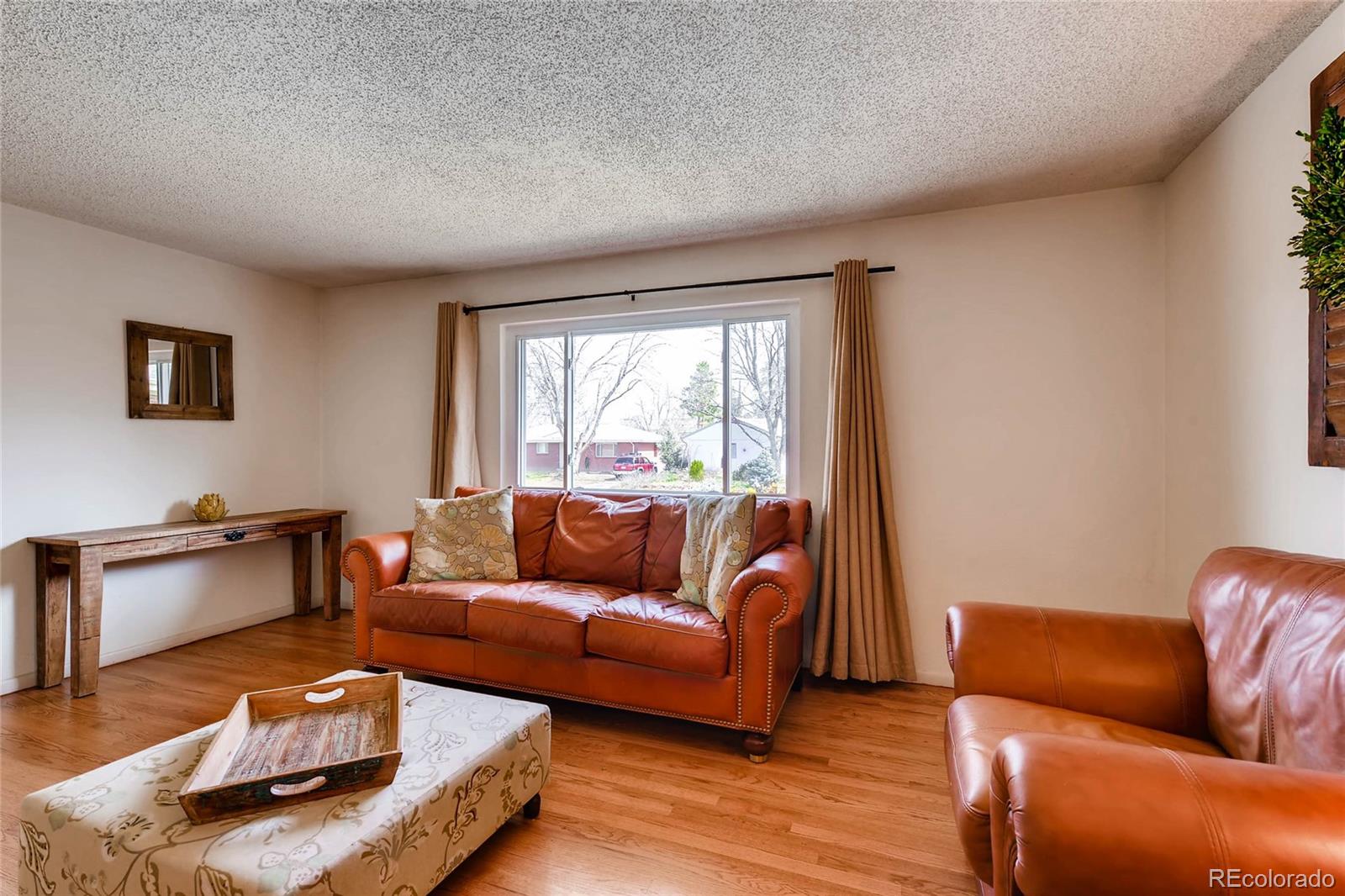 859 South Hudson Street Denver, CO 80246 - Photo 5 of 34 a living room with furniture and a window