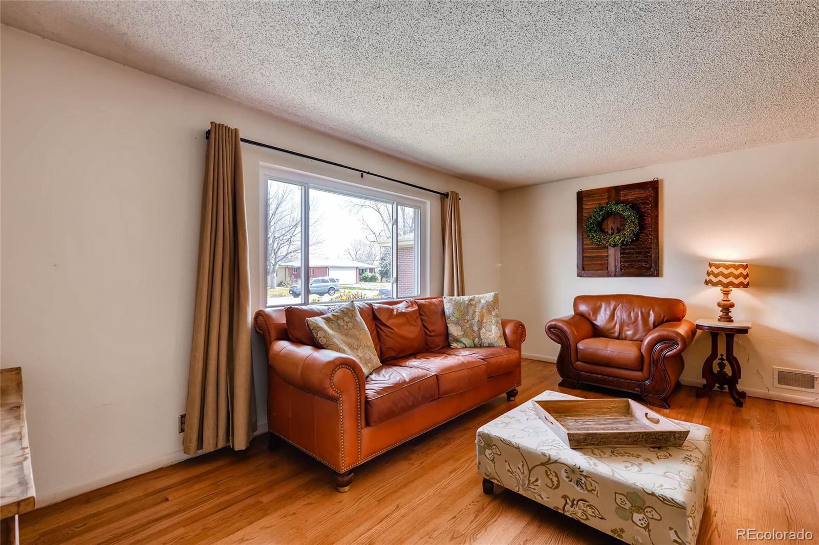 859 South Hudson Street Denver, CO 80246 - Photo 6 of 34 a living room with furniture and a window