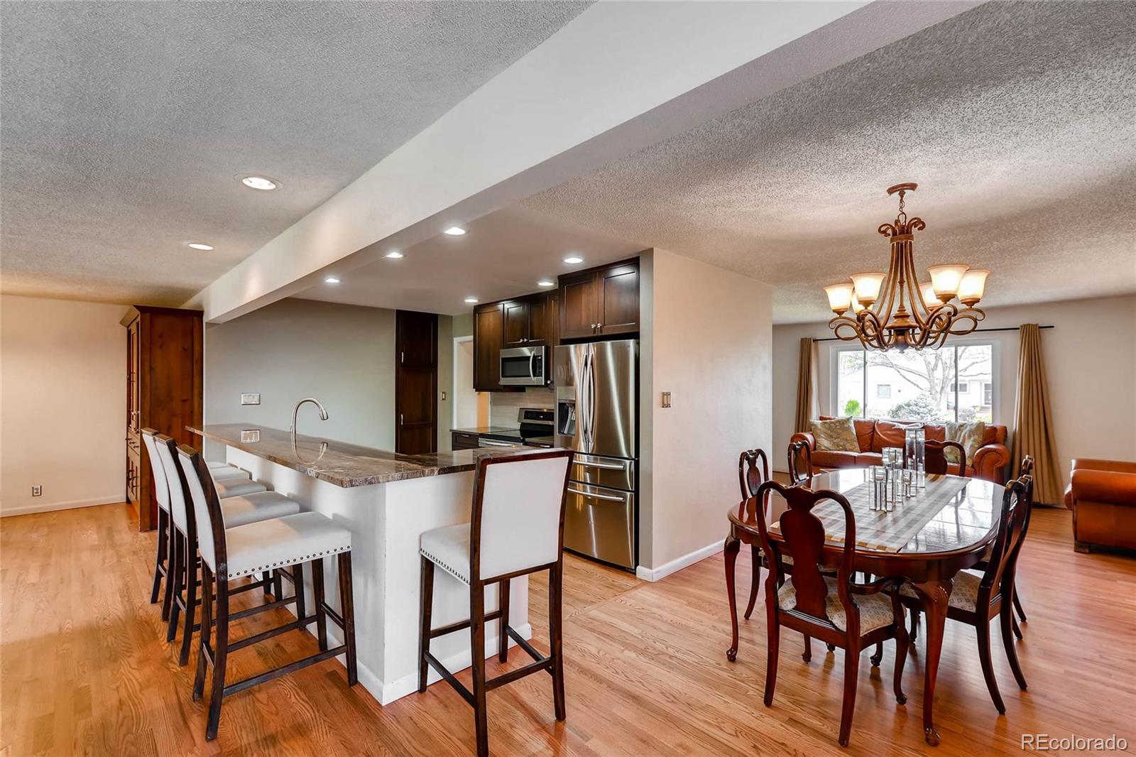 859 South Hudson Street Denver, CO 80246 - Photo 8 of 34 a view of a dining room with furniture and wooden floor