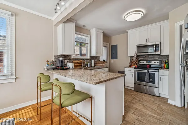 a living room with furniture and a rug