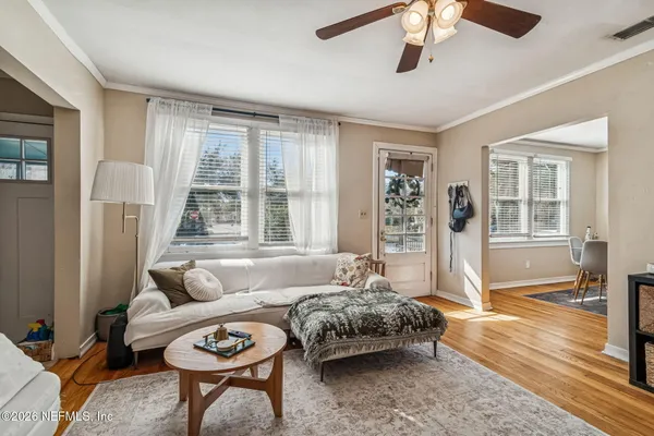 a bedroom with a bed dresser and a window
