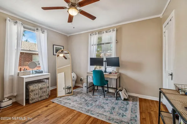 a kitchen that has a stove and a wooden cabinets