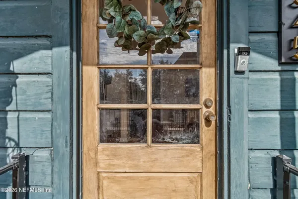a kitchen with granite countertop a sink a stove and cabinets
