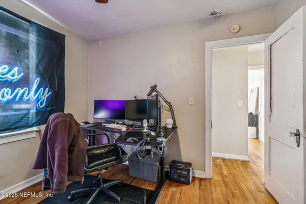 an aerial view of a house with garden space and street view