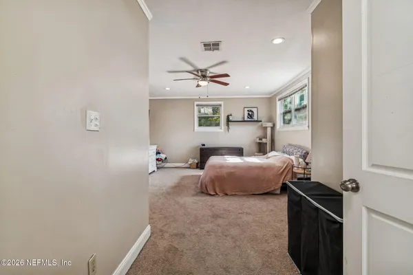 a view of a house with a yard and sitting area