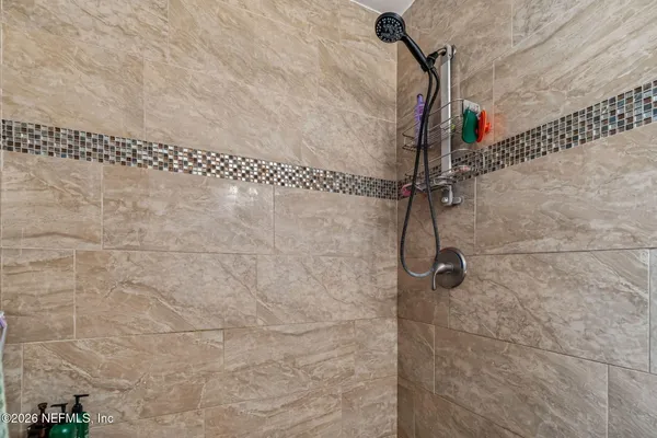 aerial view of a house with swimming pool and sitting area