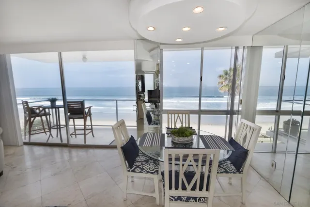 a very nice looking dining room with a large window