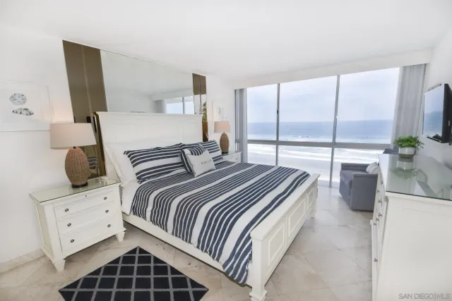 a bedroom with a bed and walk in closet