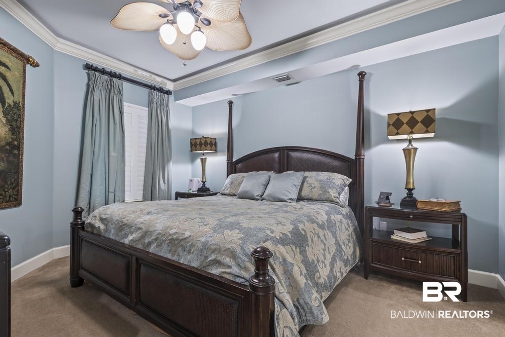 27582 Canal Road, Unit 2408 Orange Beach, AL 36561 - Photo 19 of 47 Bedroom with ceiling fan, crown molding, and light colored carpet