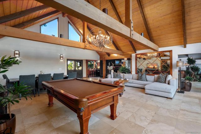 a view of patio with dining table and chairs