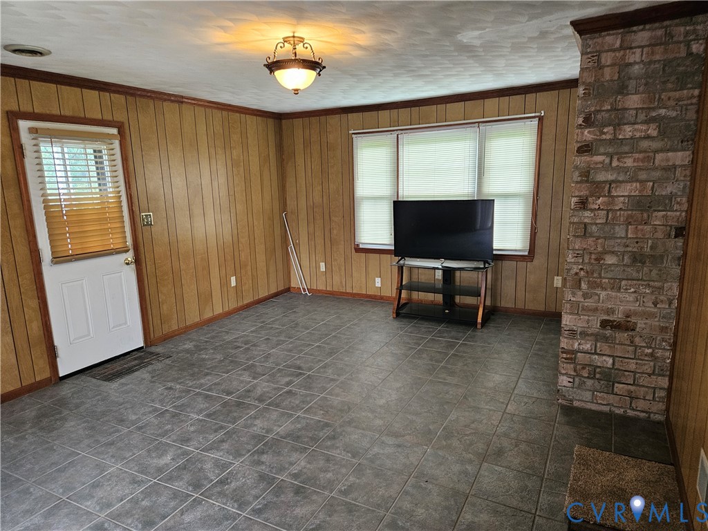 13336 Ladysmith Road Ruther Glen, VA 22580 - Photo 13 of 27 Unfurnished living room with healthy amount of nat