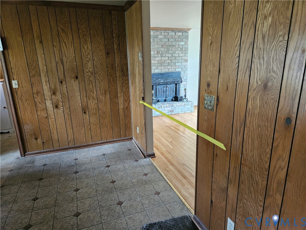 13336 Ladysmith Road Ruther Glen, VA 22580 - Photo 18 of 27 Doorway to outside with wood walls