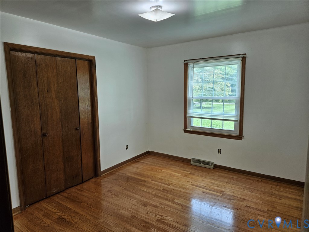 13336 Ladysmith Road Ruther Glen, VA 22580 - Photo 21 of 27 Unfurnished bedroom with wood finished floors and