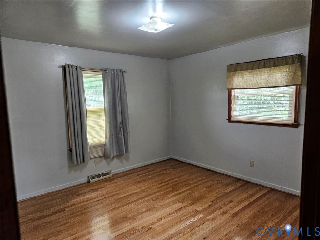 13336 Ladysmith Road Ruther Glen, VA 22580 - Photo 22 of 27 Unfurnished room with wood finished floors and bas