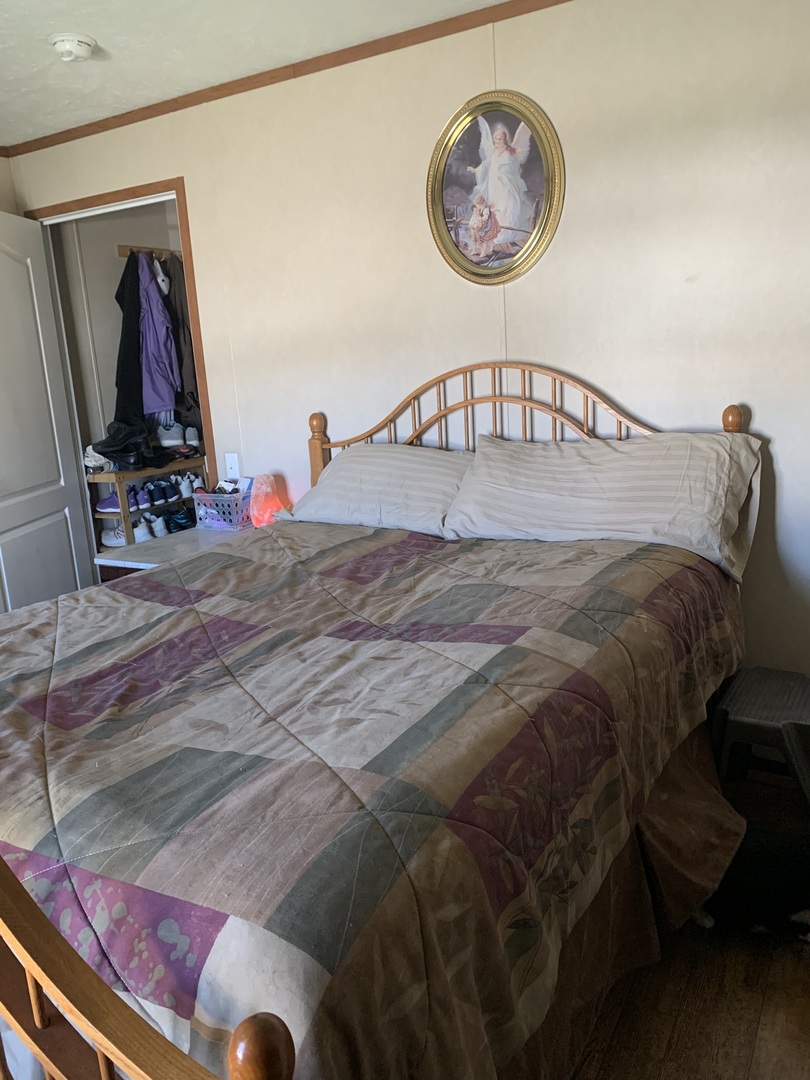 18 Troy Court Bloomington, IL 61701 - Photo 12 of 17 a bed sitting in a bedroom next to a window