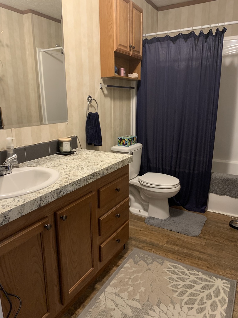 18 Troy Court Bloomington, IL 61701 - Photo 14 of 17 a bathroom with a granite countertop sink toilet and a mirror