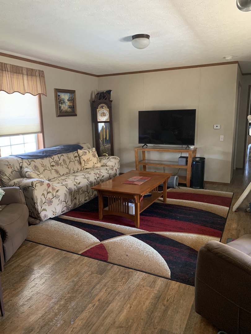 18 Troy Court Bloomington, IL 61701 - Photo 2 of 17 a bedroom with a bed and a flat screen tv