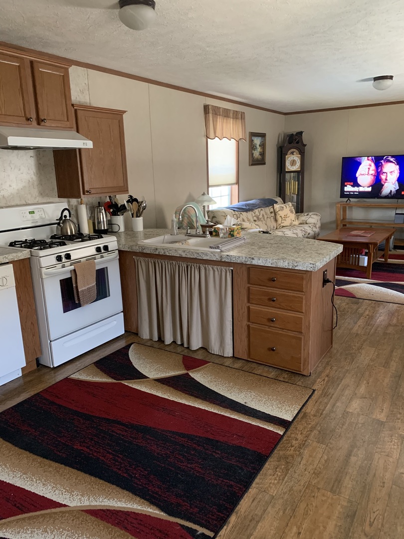 18 Troy Court Bloomington, IL 61701 - Photo 8 of 17 a kitchen with stainless steel appliances granite countertop a stove a sink and a microwave
