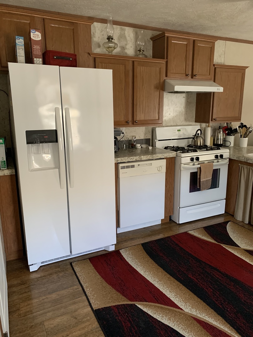 18 Troy Court Bloomington, IL 61701 - Photo 10 of 17 a kitchen with stainless steel appliances a refrigerator sink and stove