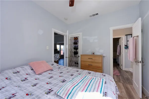 a bedroom with a bed and cabinets