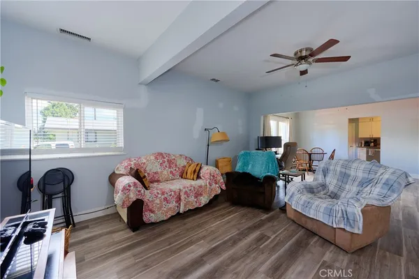 a living room with furniture and a window