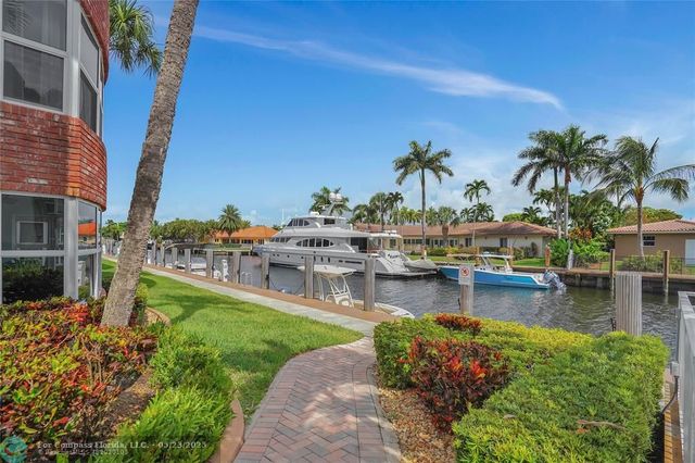 a view of a swimming pool with a garden and plants
