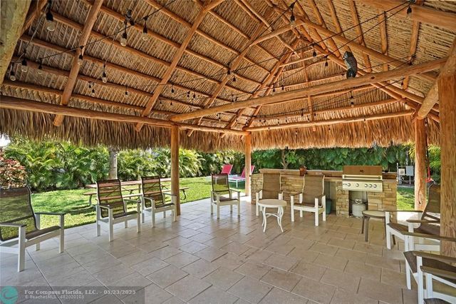 a view of a chairs and table in the patio