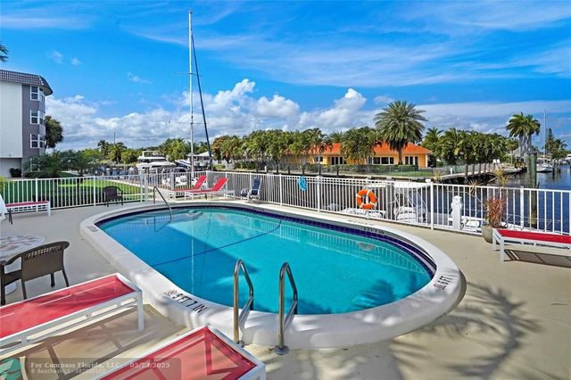 a view of a swimming pool with a lounge chair