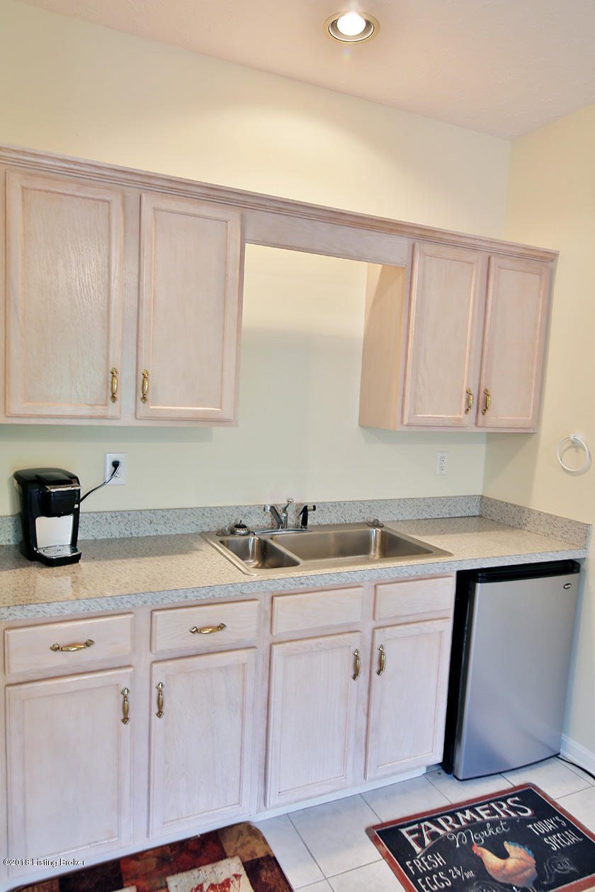 1904 Grand Ridge Road Louisville, KY 40214 - Photo 34 of 50 Wet bar/kitchenette bar. A microwave, oven/range COULD BE ADDED by the buyer if needed for extended family members. Refrigerator will remain.