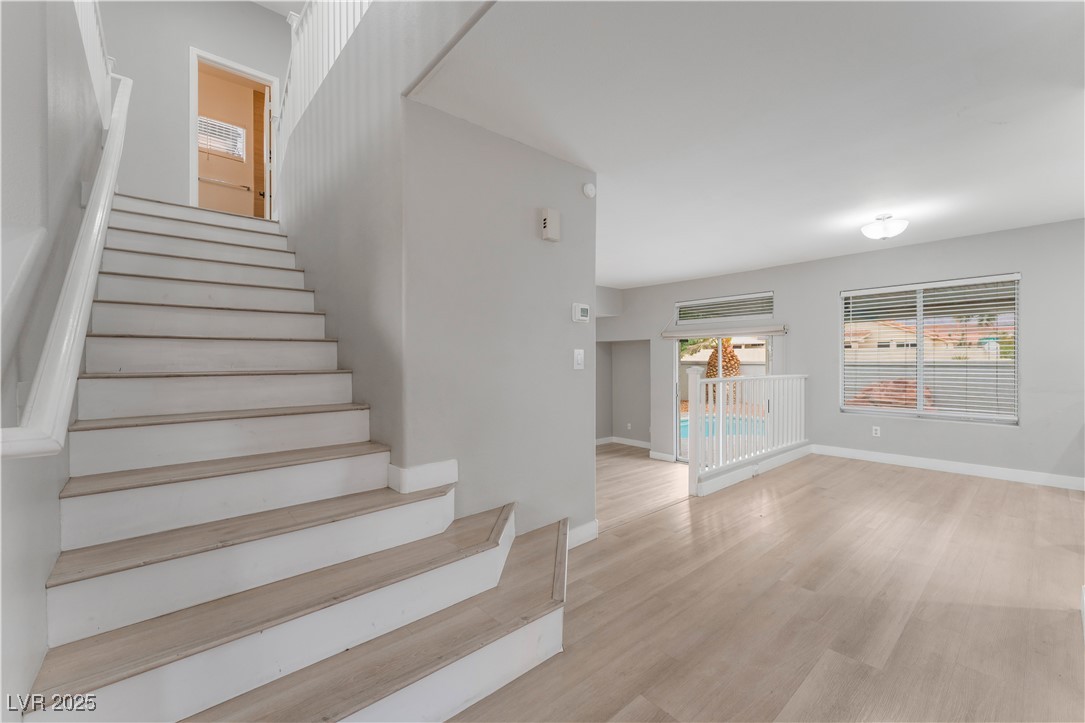 3695 Funston Way Las Vegas, NV 89129 - Photo 24 of 43 Stairs with wood finished floors and baseboards