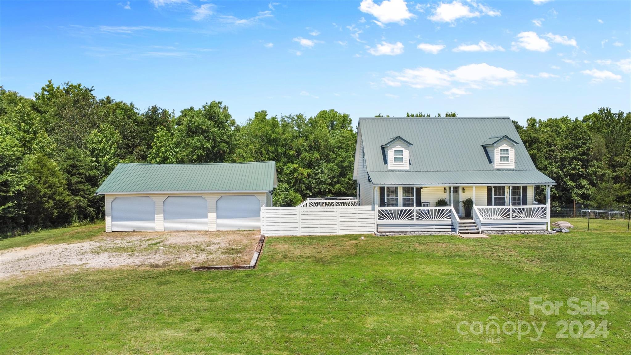 852 Langley Drive Chester, SC 29706 - Photo 1 of 35 aerial view of a house with a big yard and large trees