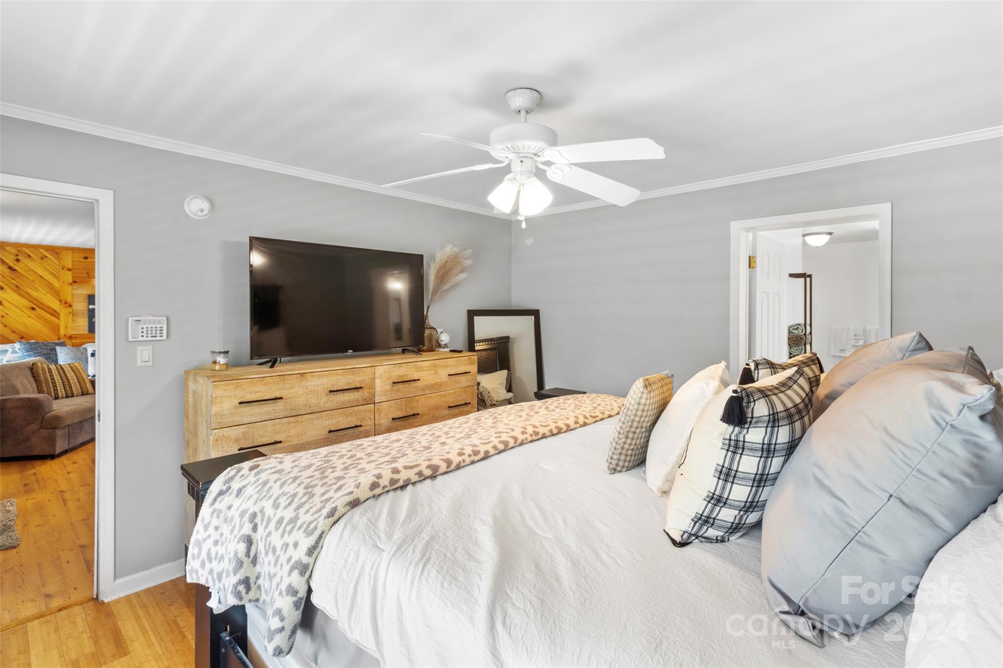 852 Langley Drive Chester, SC 29706 - Photo 20 of 35 a bedroom with a large bed and a flat screen tv