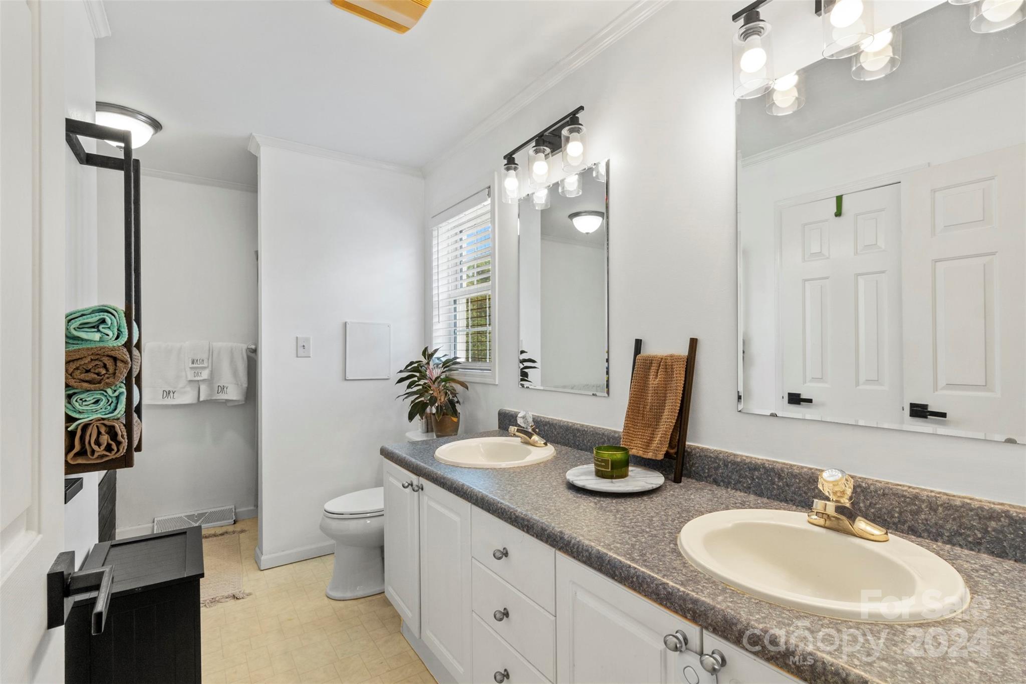852 Langley Drive Chester, SC 29706 - Photo 21 of 35 a bathroom with a double vanity sink and a mirror