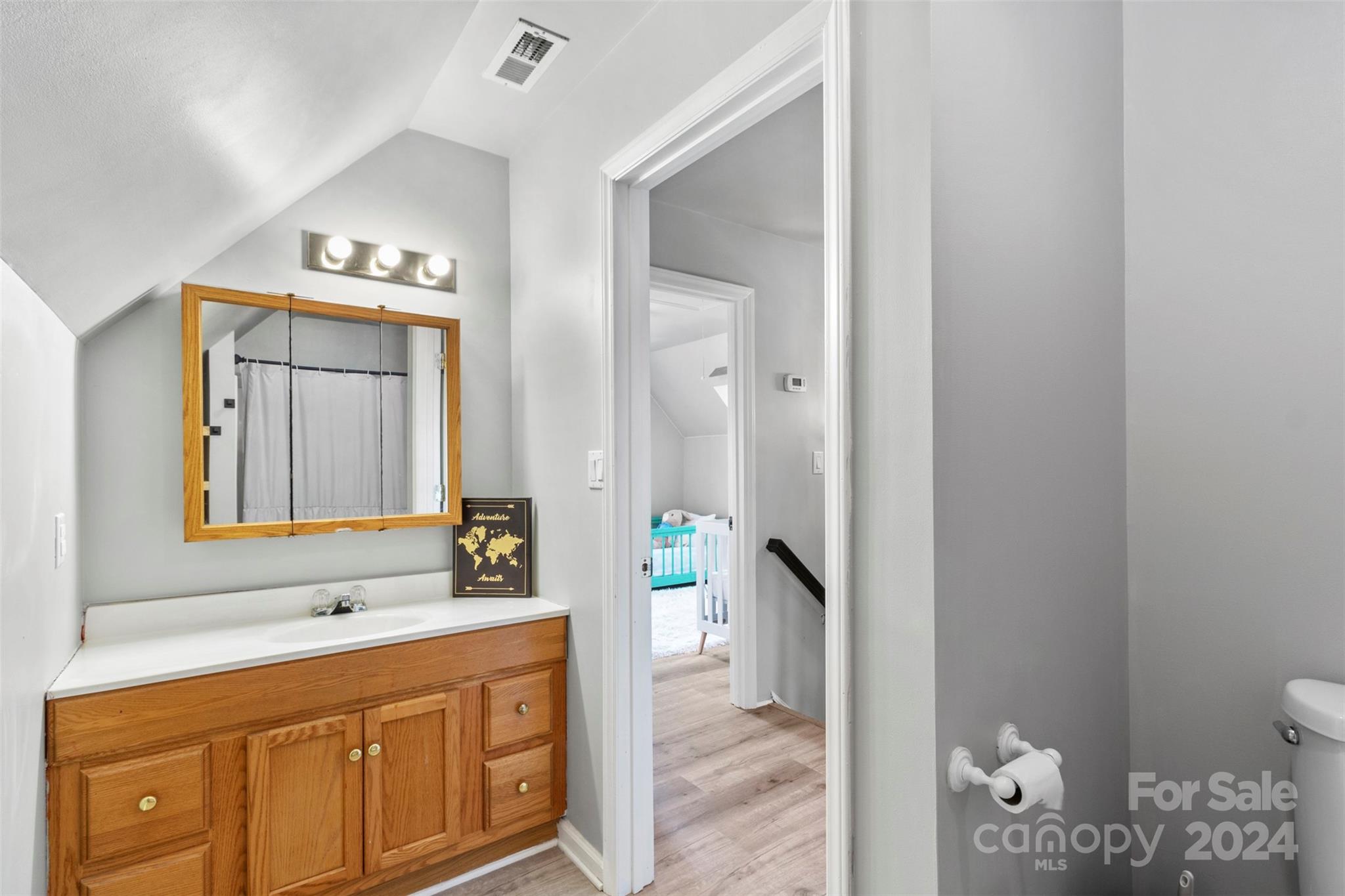 852 Langley Drive Chester, SC 29706 - Photo 27 of 35 a spacious bathroom with a granite countertop sink a mirror and a toilet