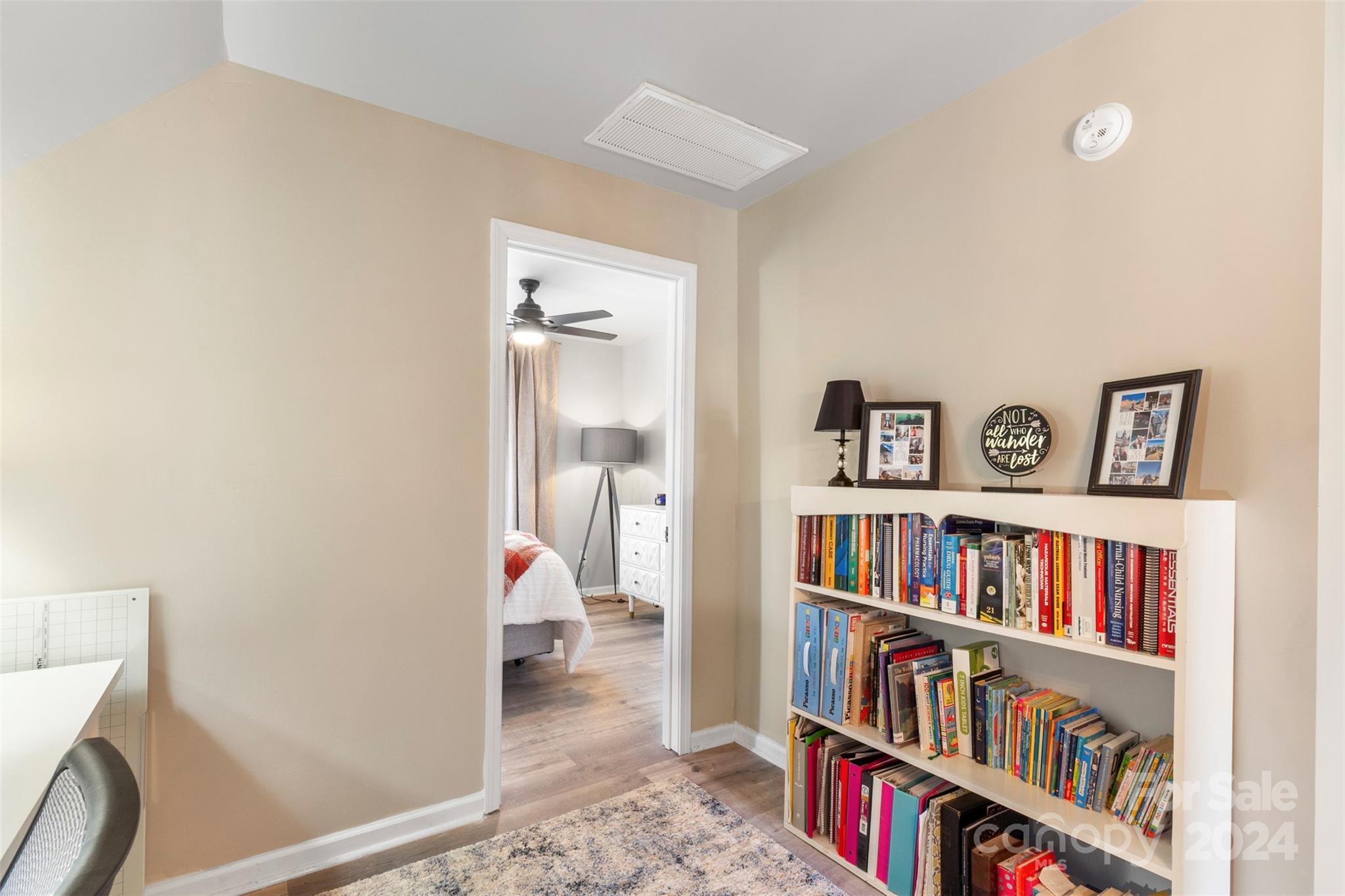 852 Langley Drive Chester, SC 29706 - Photo 29 of 35 a book shelf with books and knick knacks on it