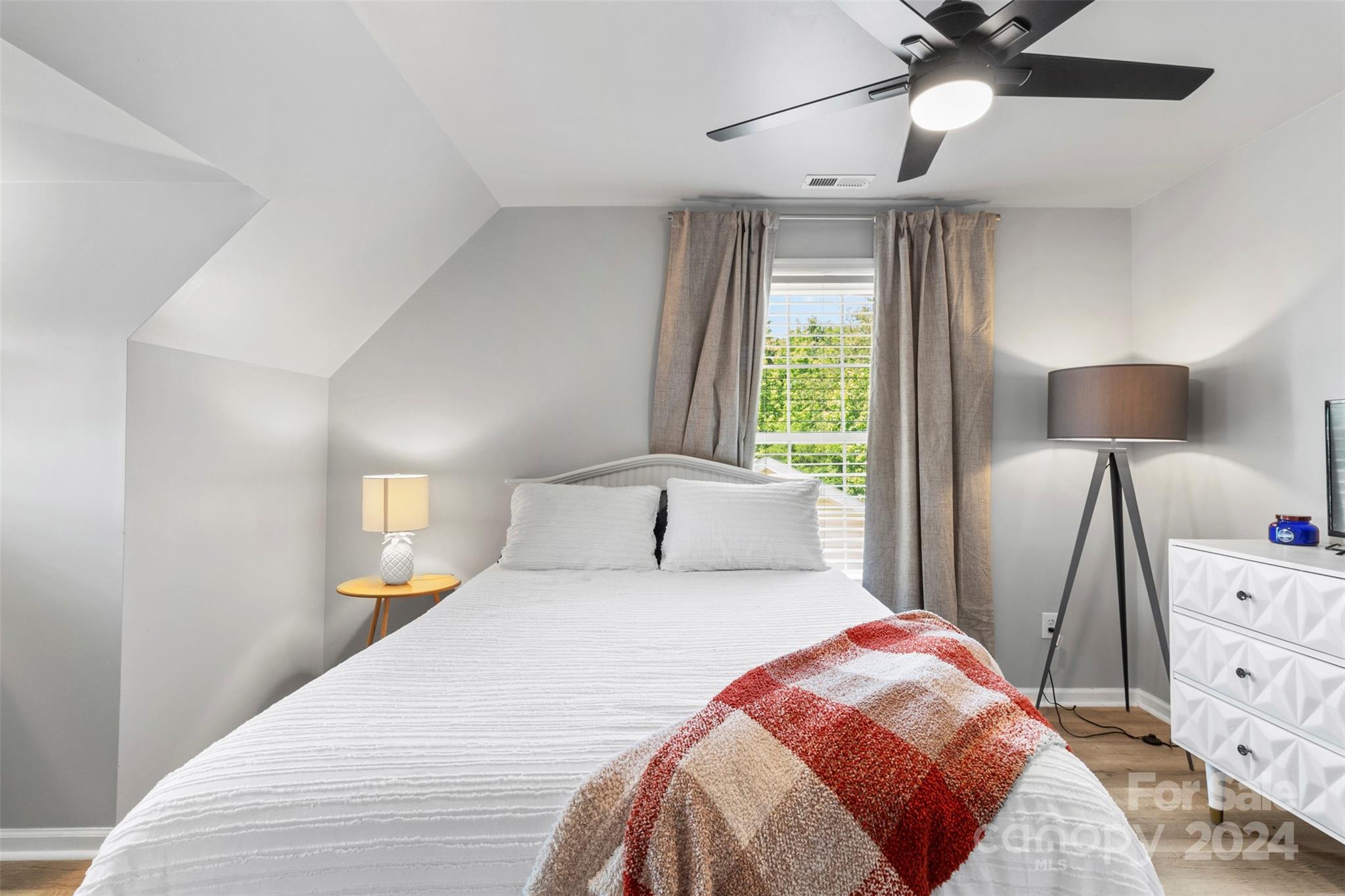 852 Langley Drive Chester, SC 29706 - Photo 30 of 35 a bedroom with a bed and a lamp on dresser