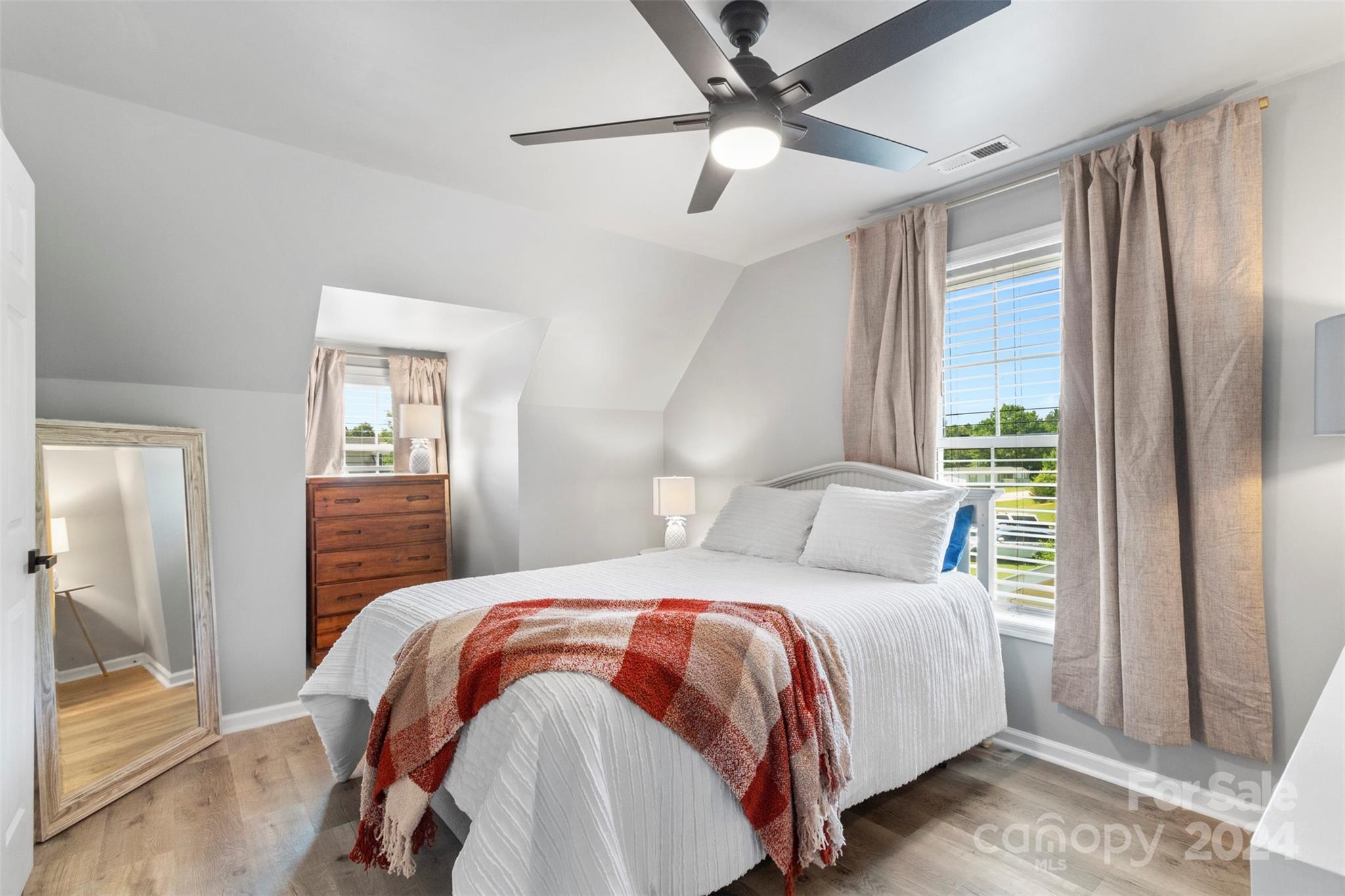 852 Langley Drive Chester, SC 29706 - Photo 31 of 35 a bedroom with a large bed and a chandelier