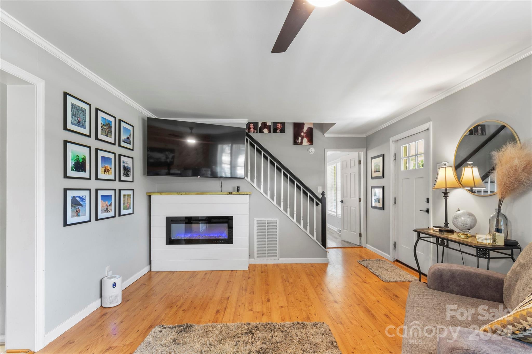 852 Langley Drive Chester, SC 29706 - Photo 9 of 35 a view of a livingroom with furniture staircase and a ceiling fan