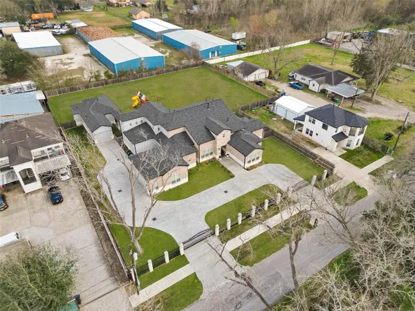 an aerial view of a house with a swimming pool