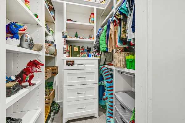 a utility room with dryer and closet