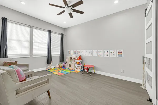 a bedroom with furniture and a window