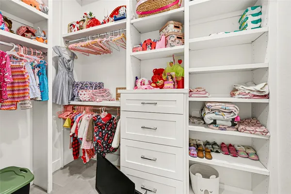 a utility room with lots of clutter and storage