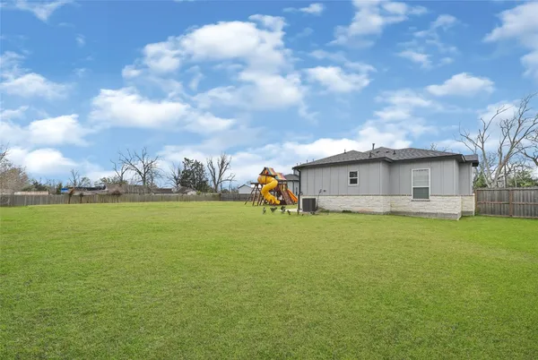 a big house with swimming pool in front of it