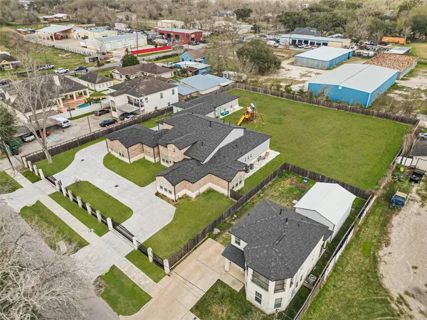 an aerial view of a house with a lake view