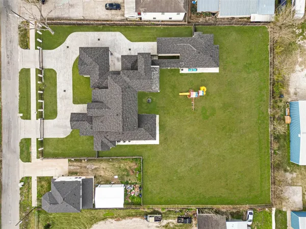 an aerial view of a house with a garden