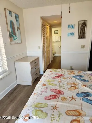 a bedroom with a bed and cabinets