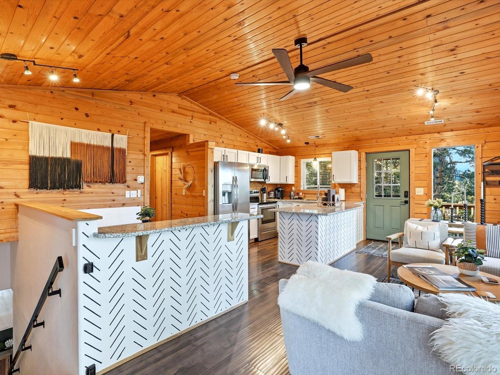 201 Moss Rock Road Bailey, CO 80421 - Photo 12 of 43 a living room with furniture and kitchen view