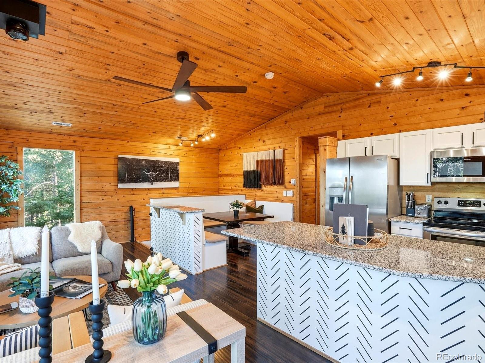201 Moss Rock Road Bailey, CO 80421 - Photo 14 of 43 a view of a living room and dining room
